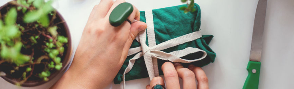 Bow being tied around a small gift